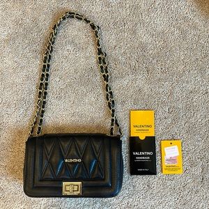 Black Valentino by Mario Valentino handbag. Gold accents.